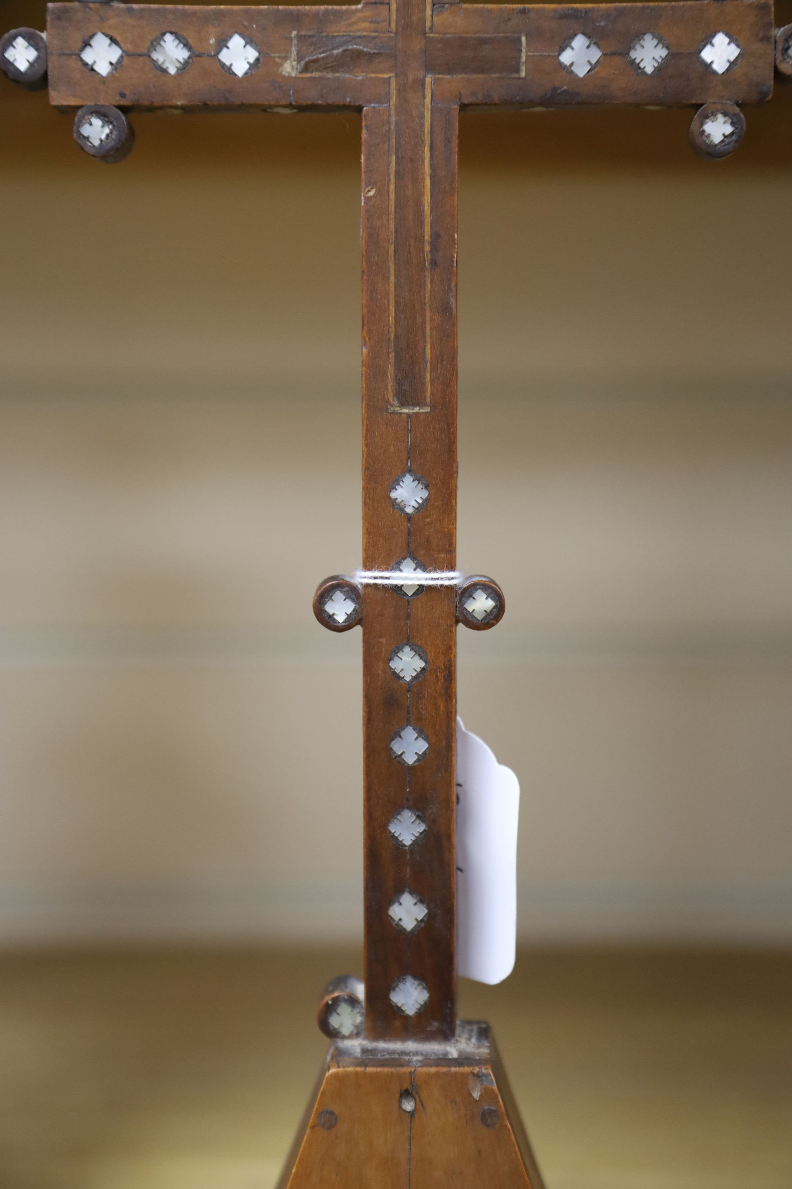 A 19th century Continental fruitwood crucifix with mother of pearl inlay, H 36cm